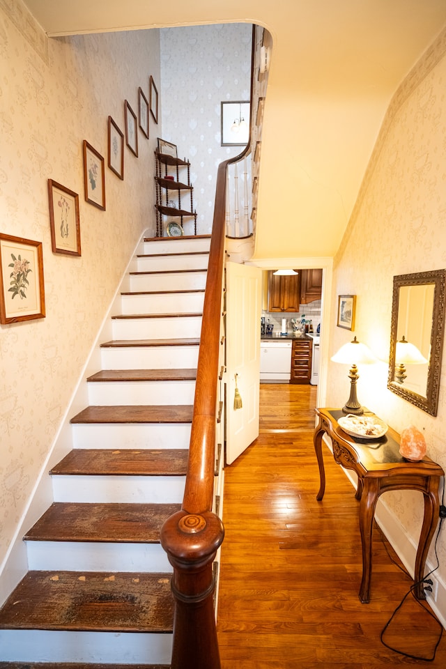 stairway featuring light hardwood / wood-style floors