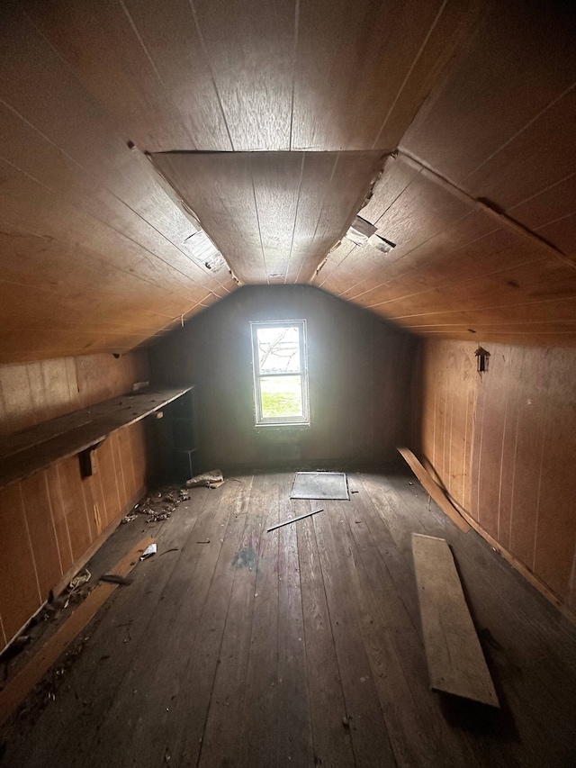 bonus room with wooden walls, wood ceiling, dark hardwood / wood-style floors, and vaulted ceiling