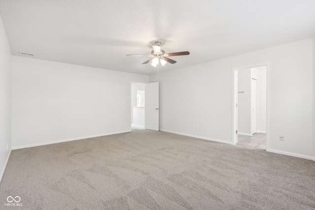 unfurnished room with light carpet and ceiling fan