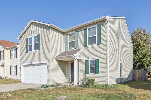 view of front of property featuring a garage and a front yard