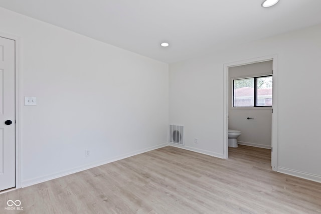 empty room with light hardwood / wood-style floors