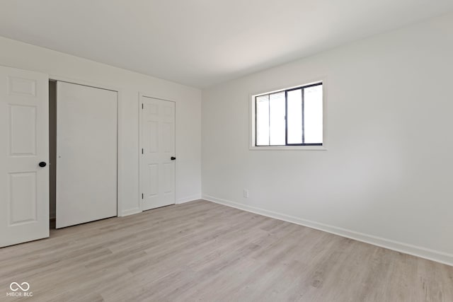 unfurnished bedroom featuring light hardwood / wood-style floors