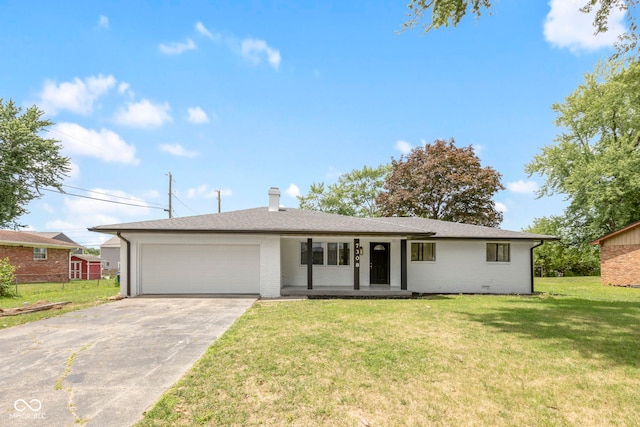 ranch-style house featuring a garage and a front lawn