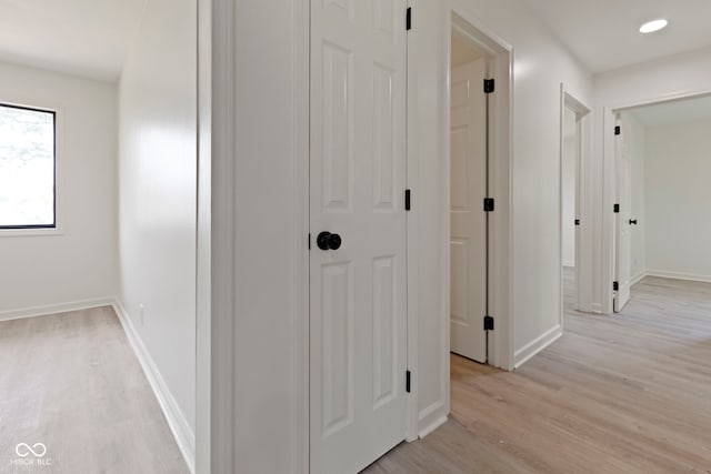 hallway with light wood-type flooring