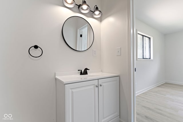 bathroom featuring vanity and hardwood / wood-style flooring