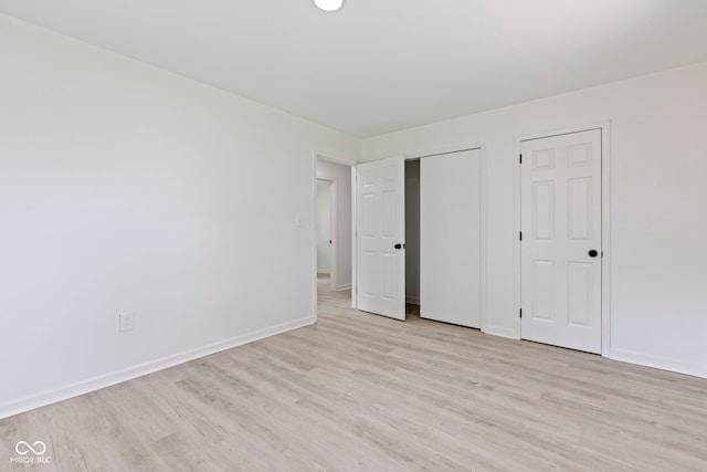 unfurnished bedroom with light wood-type flooring