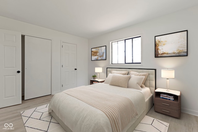 bedroom with light wood-type flooring