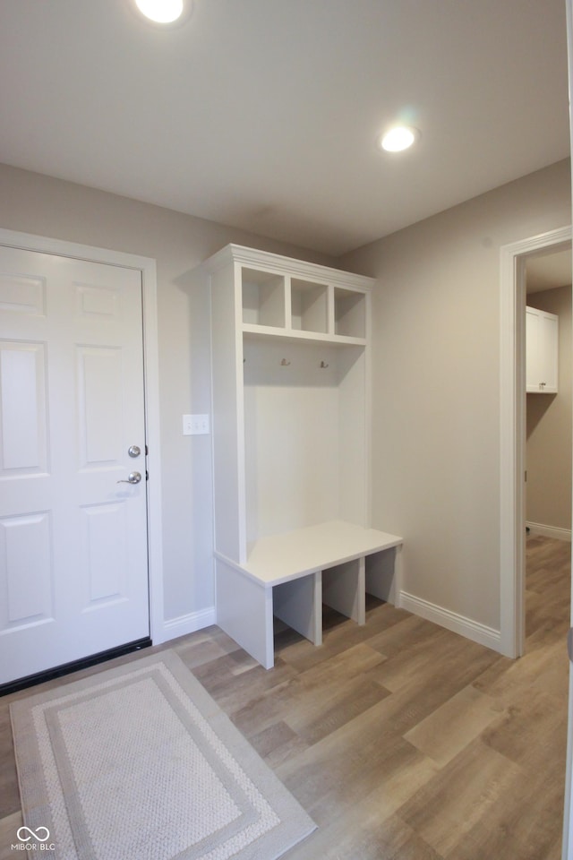 mudroom with light hardwood / wood-style floors