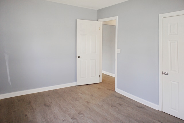 unfurnished bedroom with light wood-type flooring