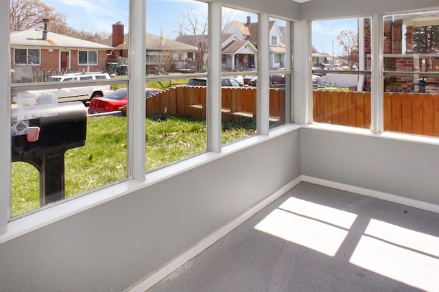 unfurnished sunroom with plenty of natural light