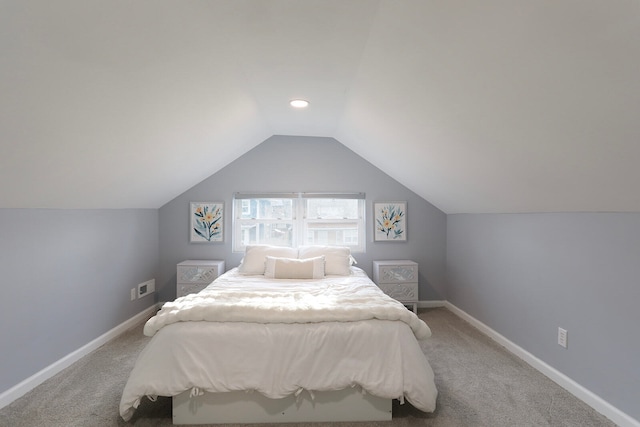 bedroom with carpet and lofted ceiling