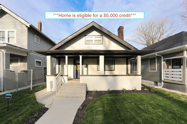 view of front of property with a front yard and a porch