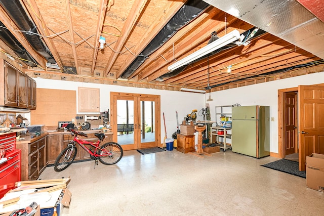 basement with french doors and fridge