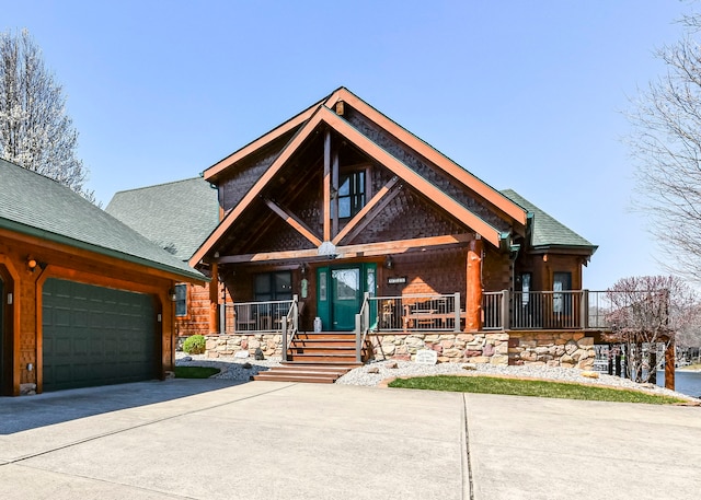 view of front of house with a porch and a garage