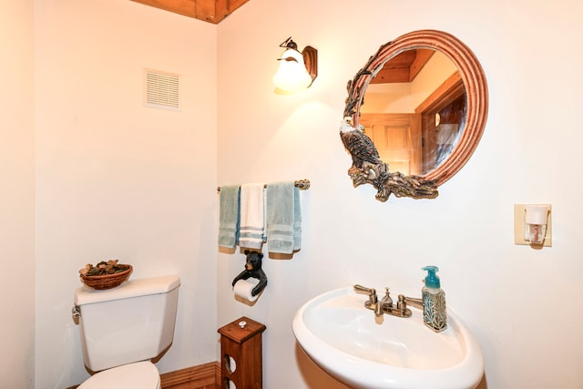 bathroom with sink and toilet