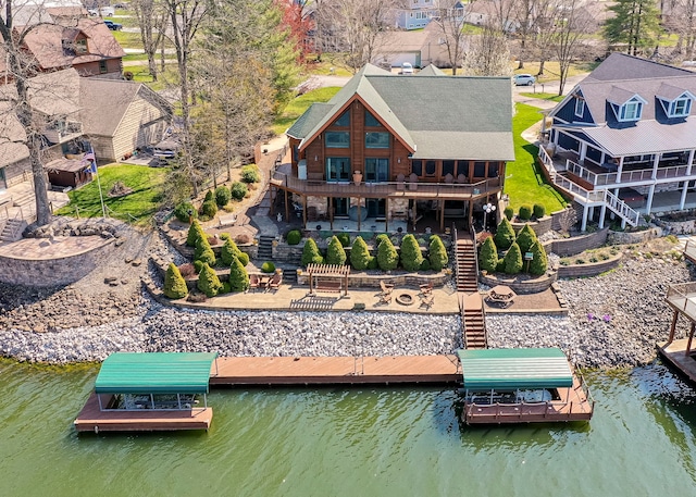 exterior space featuring a water view and a patio area