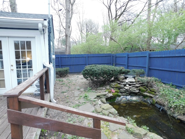 view of yard featuring a garden pond