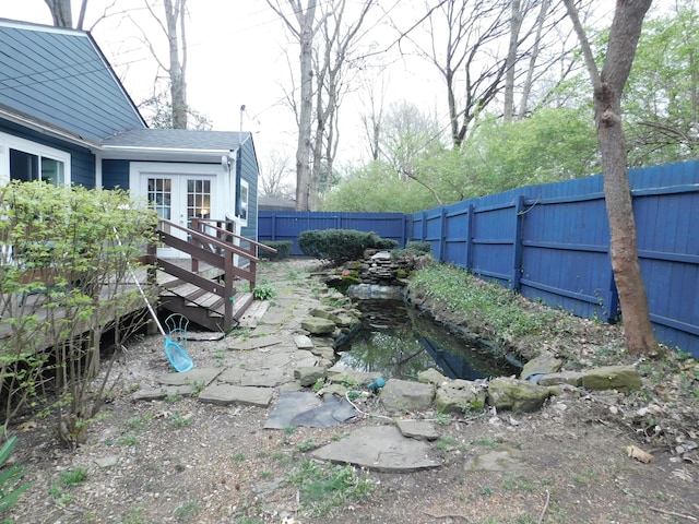 view of yard with a wooden deck