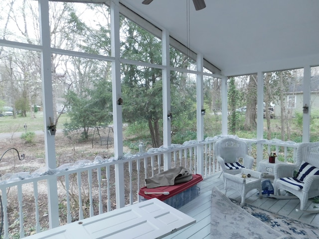 sunroom / solarium with ceiling fan