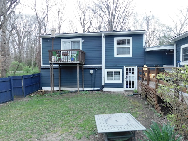 rear view of house with a lawn