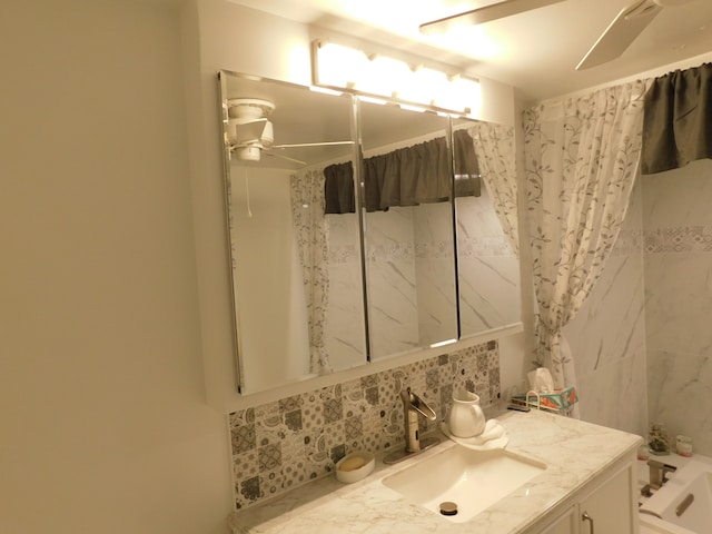 bathroom featuring vanity, ceiling fan, and a shower with shower curtain