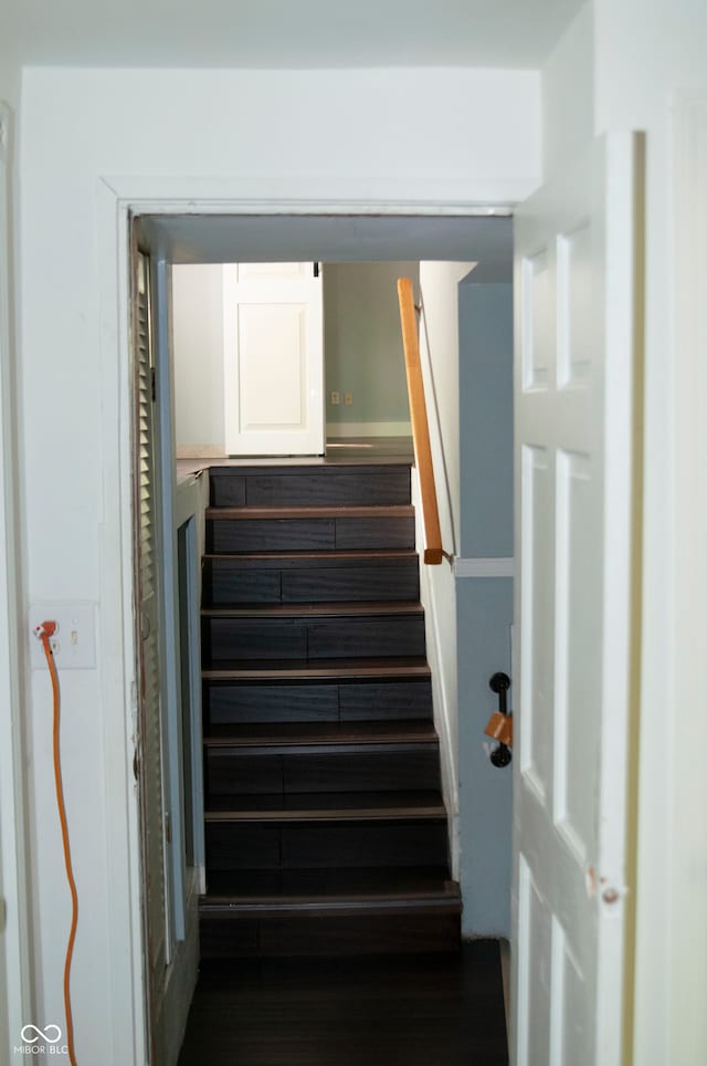 stairs with hardwood / wood-style flooring