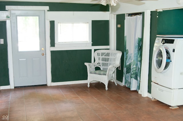 washroom featuring tile patterned flooring, ceiling fan, and washer / clothes dryer