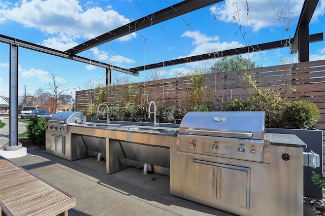 view of patio / terrace with area for grilling, sink, and grilling area