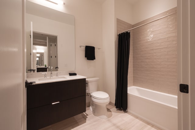 full bathroom featuring vanity, toilet, and shower / bath combo with shower curtain