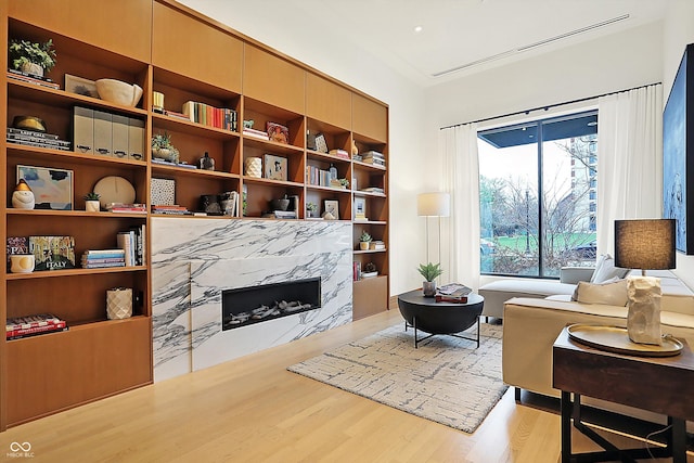 sitting room with light hardwood / wood-style floors