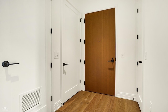 corridor featuring light hardwood / wood-style floors