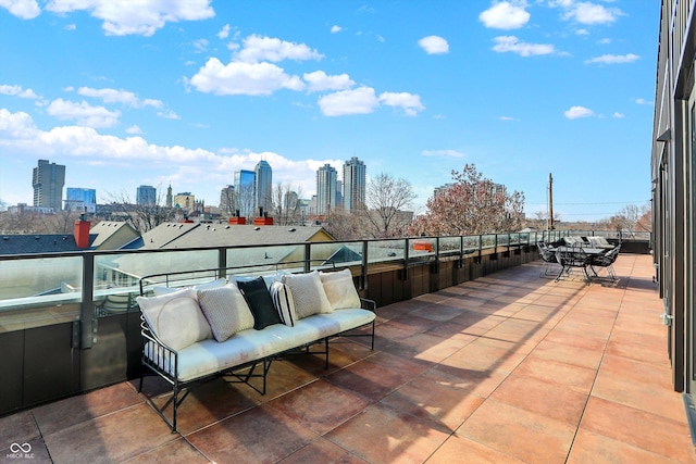 view of patio featuring a balcony