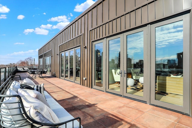 view of patio / terrace featuring french doors and a balcony