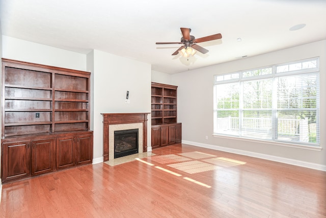 unfurnished living room featuring light hardwood / wood-style flooring and a healthy amount of sunlight