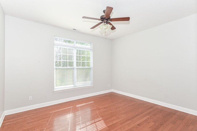 empty room with light hardwood / wood-style floors and ceiling fan