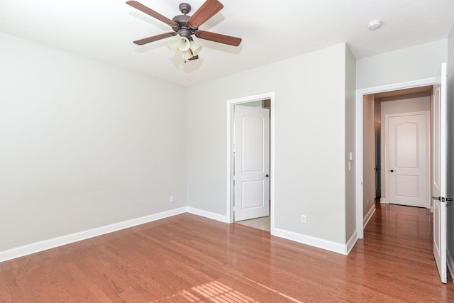 unfurnished room featuring light hardwood / wood-style flooring and ceiling fan