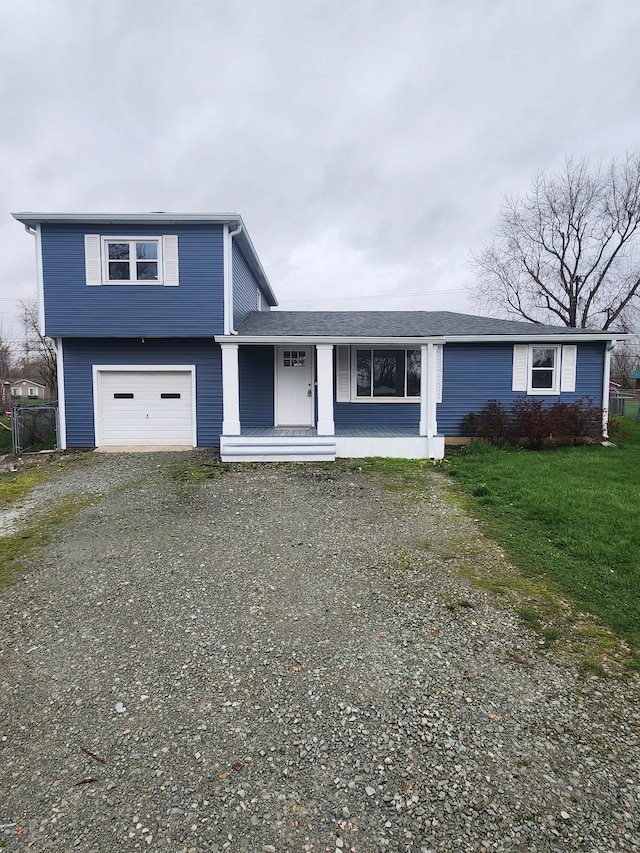 view of front of house with a front lawn and a garage