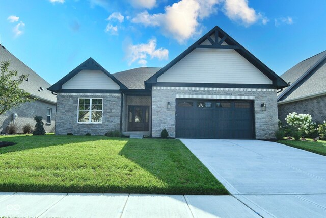 view of front of house featuring a garage and a front yard