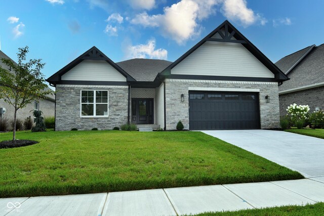 view of front of property with a garage and a front yard