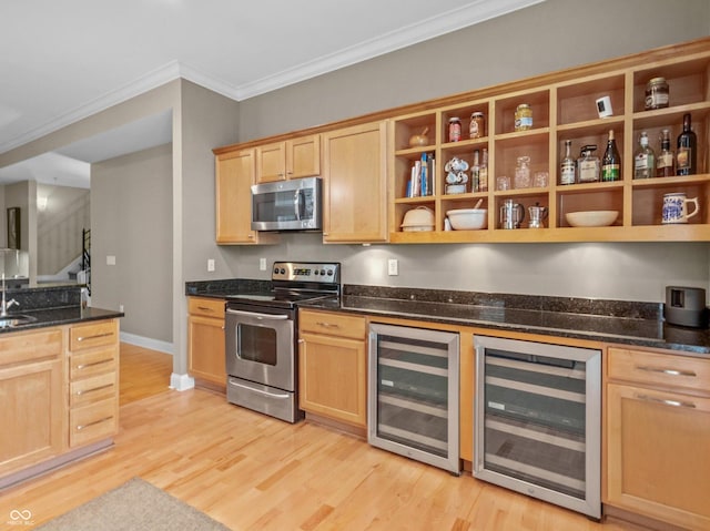 kitchen with wine cooler, crown molding, light hardwood / wood-style floors, and appliances with stainless steel finishes