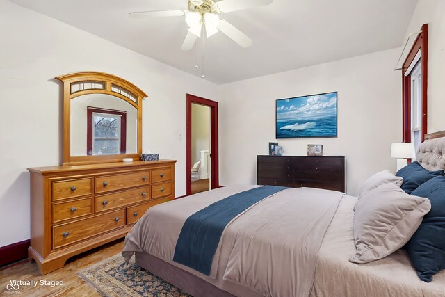 bedroom featuring a ceiling fan and wood finished floors