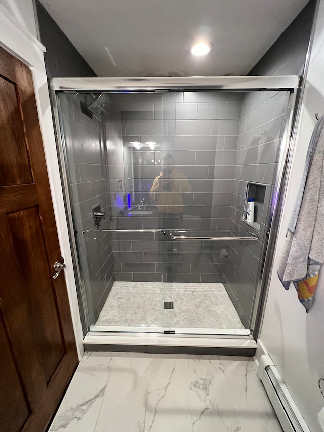 bathroom with tile flooring, a baseboard radiator, and walk in shower