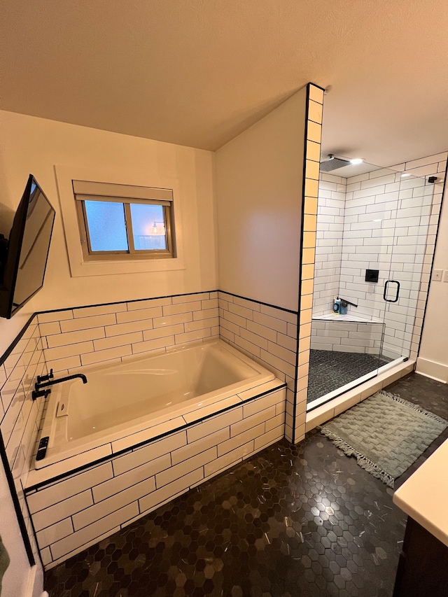 bathroom with tile flooring, separate shower and tub, and vanity