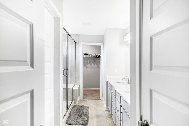 bathroom with vanity and an enclosed shower