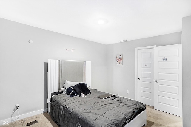 bedroom with light carpet