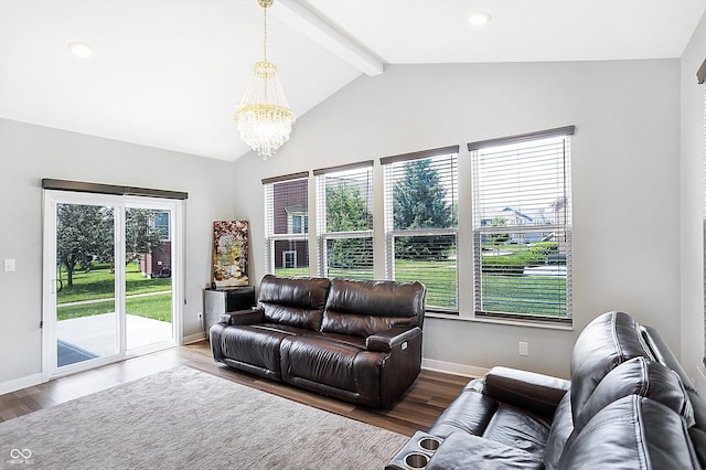 living room featuring hardwood / wood-style flooring, a chandelier, and vaulted ceiling with beams