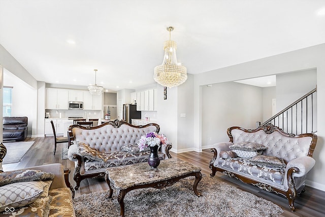 living room featuring hardwood / wood-style floors and an inviting chandelier