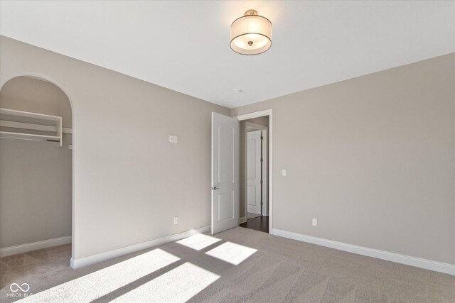 unfurnished bedroom featuring a closet and carpet