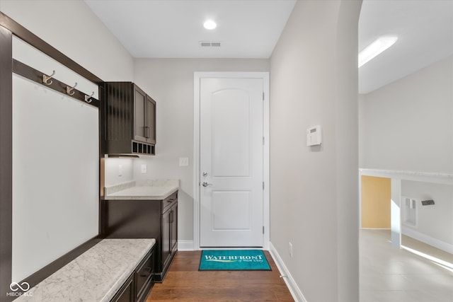 mudroom with dark hardwood / wood-style floors