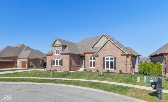 view of front of home featuring a garage and a front yard